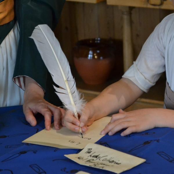 Writing-with-a-quill-and-ink-5-e1758725128428